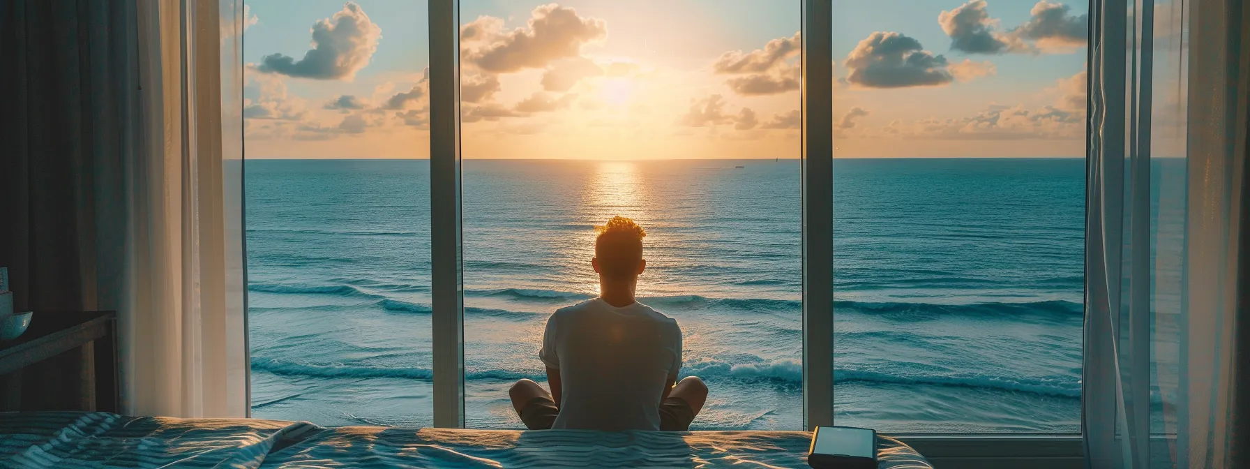 a person in miami carefully comparing mortgage refinance lenders on a sunny beach overlooking the ocean.